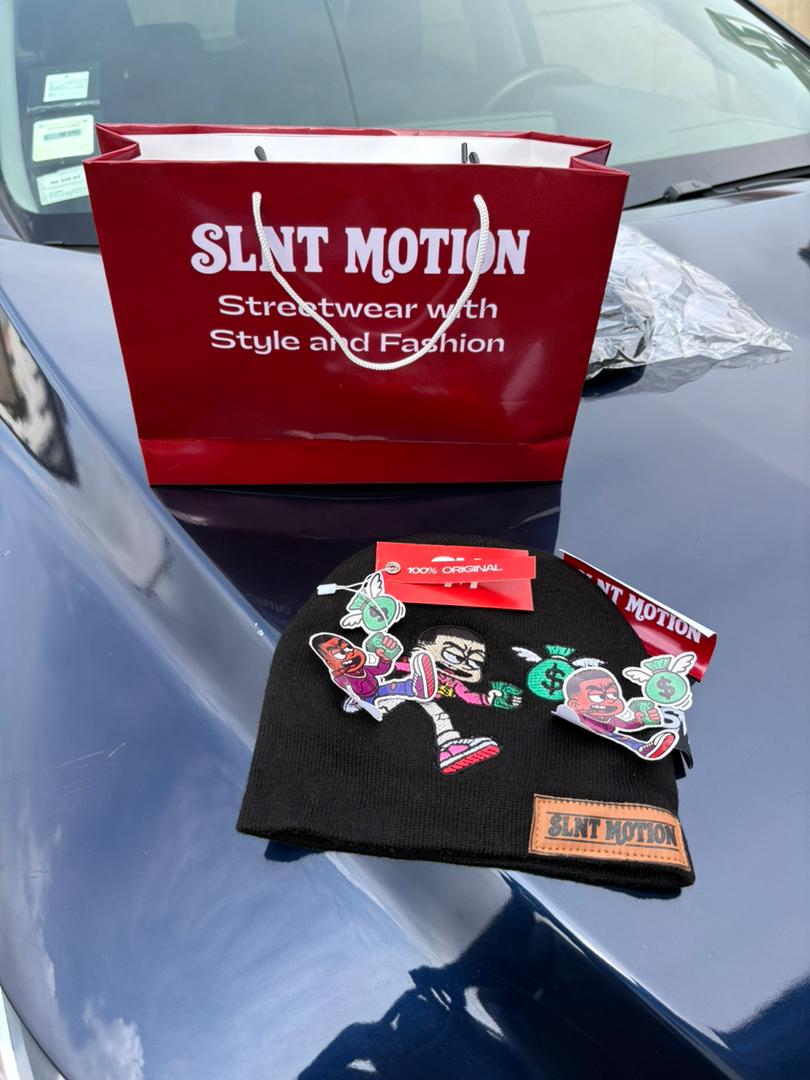 SLNT MOTION branded shopping bag beside the beanie